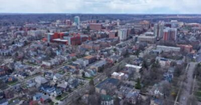 A view from the sky of Ann Arbor, Michigan, featuring many homes and buildings.